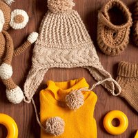 An easy one-size blanket sweater with instructions for both crochet and knit versions.