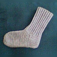 Free crocheted socks pattern for a 9 to 9 1/2 inch foot, in 4 ply worsted with a 4.50 mm hook, with notes on where to add or leave out rows for other sizes.
