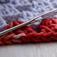 A crocheted beanie with a honeycomb cable texture, finishing at 9 inches wide by 9 inches tall, in worsted weight yarn with a 6mm hook.