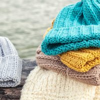 Using handmade textiles to warm up a home -- cushion covers, throws, table linen and where handwork has most effect.