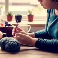 What to know before starting a crocheted afghan -- construction methods, yarn quantities, and keeping a large piece even.